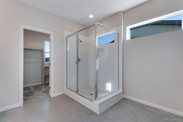 13398 E 99th Pl, Commerce City, CO 80022 - full bath with a stall shower, baseboards, a walk in closet, plenty of natural light, and recessed lighting