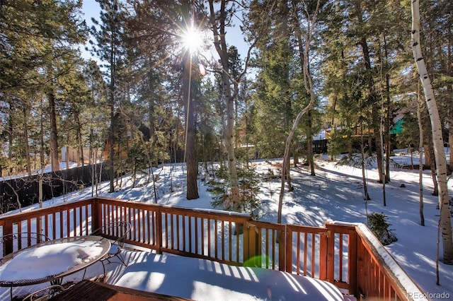 view of snow covered deck