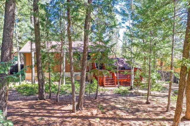 1321 W Midland Ave, Woodland Park, CO 80863 - view of front facade with a wooden deck