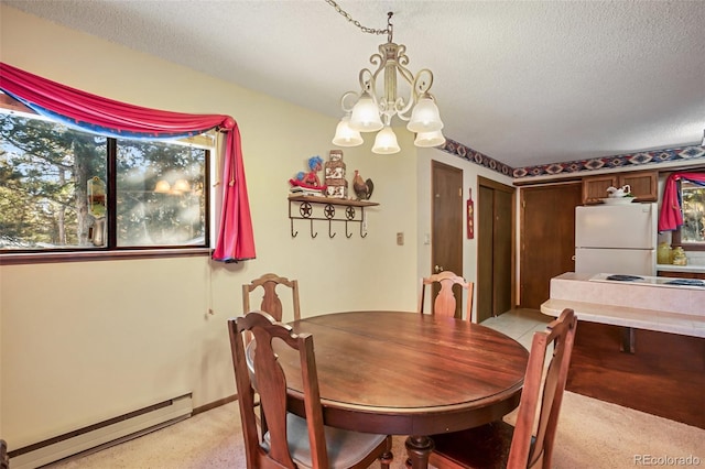 1321 W Midland Ave, Woodland Park, CO 80863 - dining space with a baseboard radiator, a textured ceiling, a chandelier, and light colored carpet