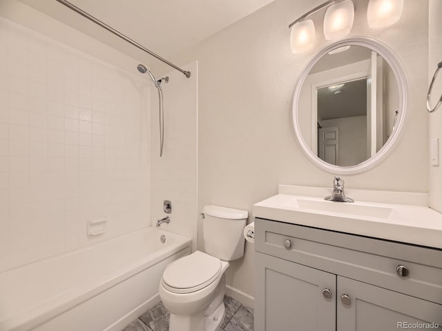 full bathroom with vanity, toilet, and tiled shower / bath