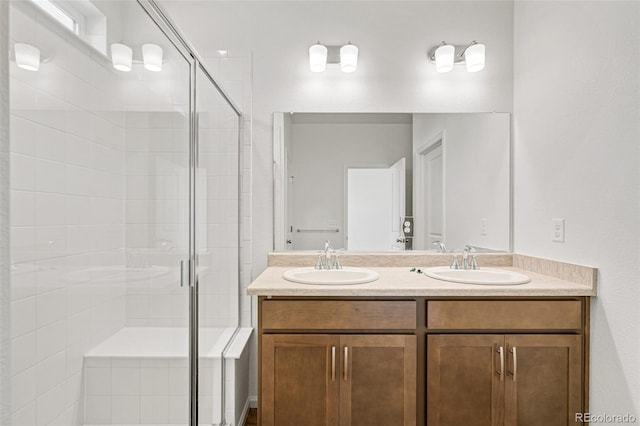9343 Biscay St, Commerce City, CO 80022 - bathroom with a stall shower, double vanity, and a sink