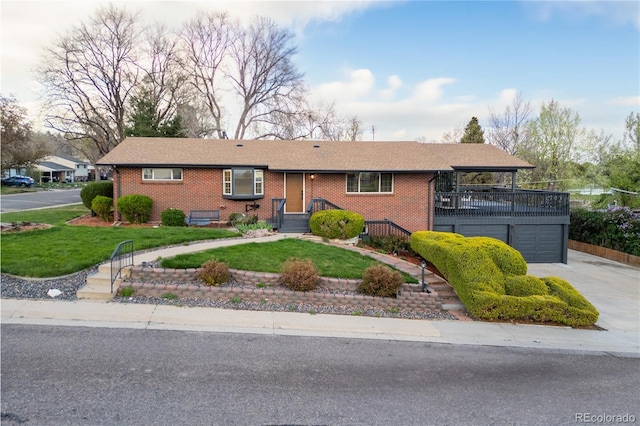 8079 W 67th Ave, Arvada, CO 80004 - ranch-style home with concrete driveway, brick siding, a front yard, and an attached garage