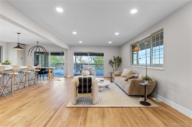 8079 W 67th Ave, Arvada, CO 80004 - living area featuring wood finished floors and recessed lighting