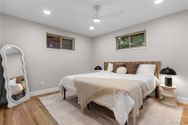 8079 W 67th Ave, Arvada, CO 80004 - bedroom with light wood-type flooring, recessed lighting, and ceiling fan