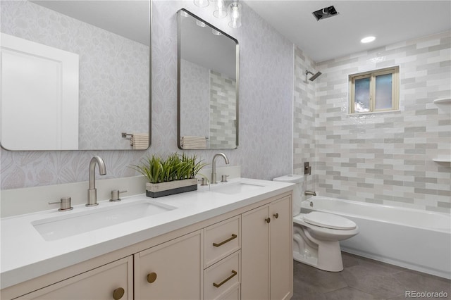 8079 W 67th Ave, Arvada, CO 80004 - full bath with double vanity, bathtub / shower combination, tile patterned flooring, wallpapered walls, and recessed lighting