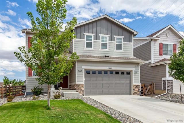 craftsman-style home featuring a garage and a front yard