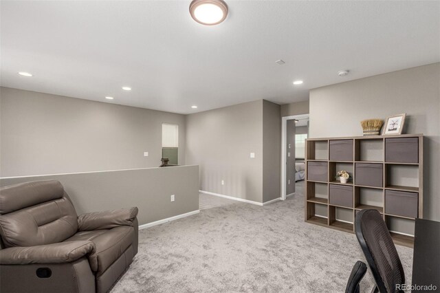 living area featuring light colored carpet