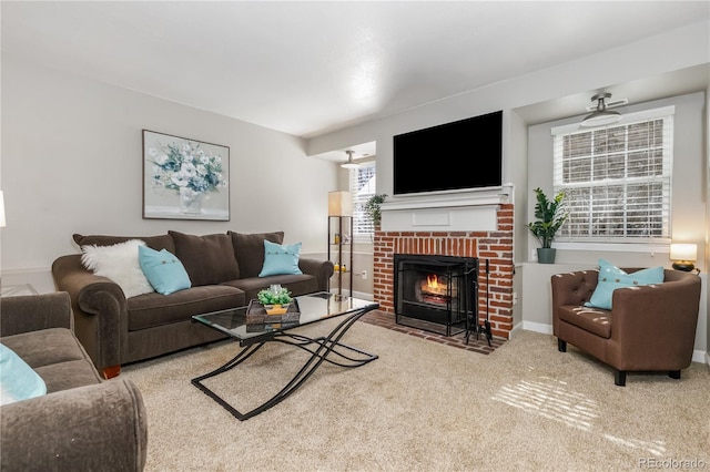 living room with carpet flooring, a fireplace, and baseboards