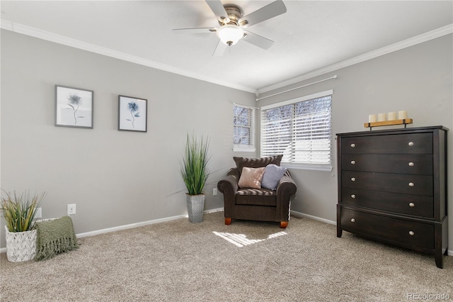 sitting room featuring light carpet, baseboards, and ornamental molding