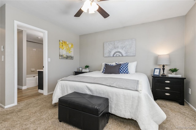 bedroom with baseboards, light colored carpet, and a ceiling fan