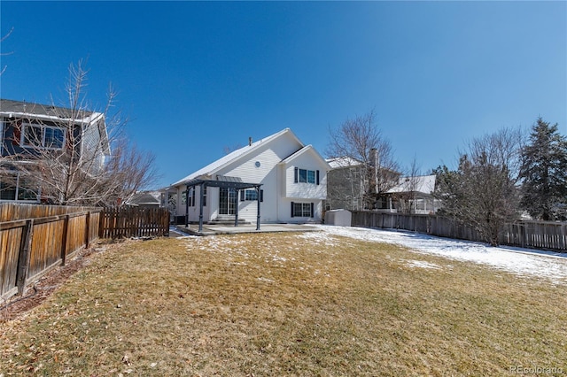 back of house featuring a patio area, a fenced backyard, a pergola, and a yard