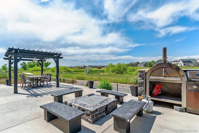 20503 E 50th Pl, Denver, CO 80249 - view of patio / terrace featuring an outdoor kitchen, a pergola, a fire pit, and outdoor dining area