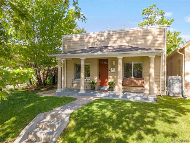 3929 Shoshone St, Denver, CO 80211 - view of front of property featuring covered porch and a front lawn