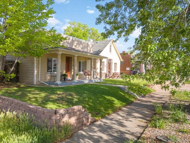 3929 Shoshone St, Denver, CO 80211 - view of front of property with a front lawn and a patio