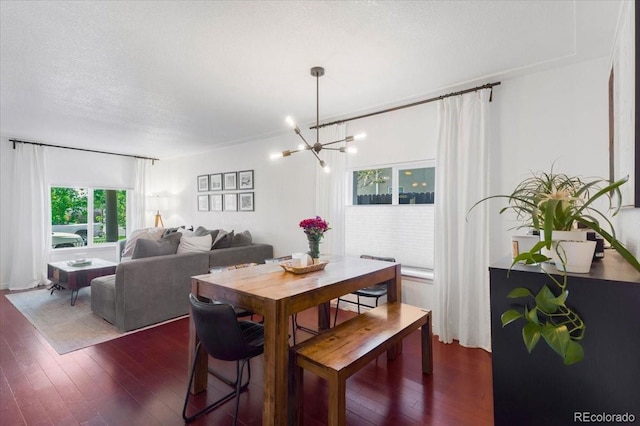3929 Shoshone St, Denver, CO 80211 - dining area with a chandelier and dark wood-style flooring