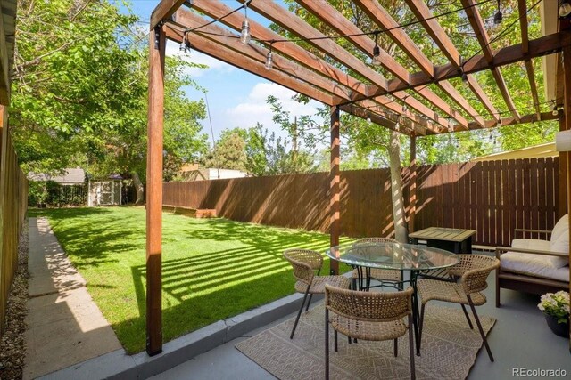 3929 Shoshone St, Denver, CO 80211 - view of patio / terrace with a pergola, an outbuilding, outdoor dining area, and a storage unit