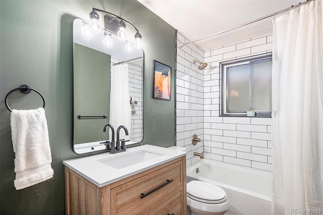 full bathroom featuring vanity, shower / bath combo with shower curtain, and toilet