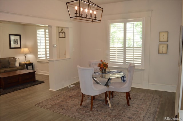 1215 10th Ave, Greeley, CO 80631 - dining area with wood finished floors and a chandelier
