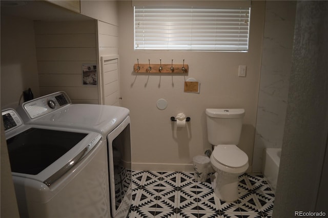 1215 10th Ave, Greeley, CO 80631 - laundry room with separate washer and dryer and light tile patterned flooring