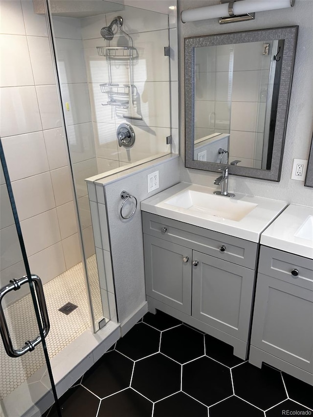 1215 10th Ave, Greeley, CO 80631 - bathroom featuring vanity, a shower stall, and tile patterned flooring