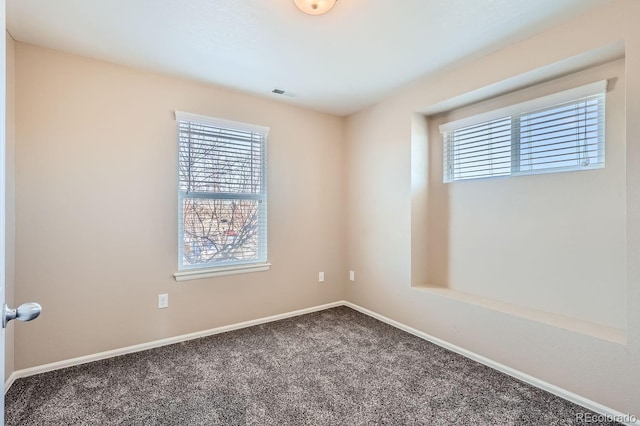 unfurnished room featuring carpet flooring