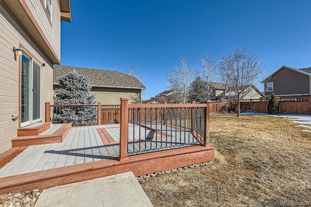 wooden deck with a lawn