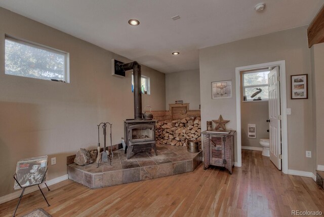 136 W Buckskin Rd, Alma, CO 80420 - living area with wood finished floors, recessed lighting, baseboards, and a wood stove