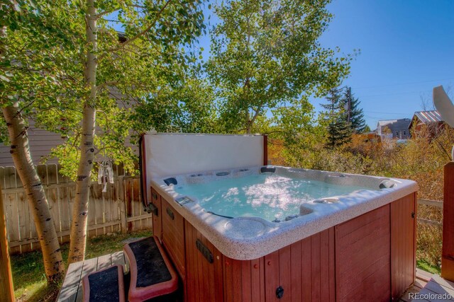 136 W Buckskin Rd, Alma, CO 80420 - view of patio with a hot tub and fence