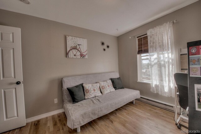 136 W Buckskin Rd, Alma, CO 80420 - sitting room with baseboards, a baseboard heating unit, and wood finished floors