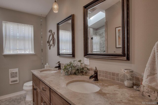 136 W Buckskin Rd, Alma, CO 80420 - full bathroom featuring heating unit, double vanity, toilet, and a sink