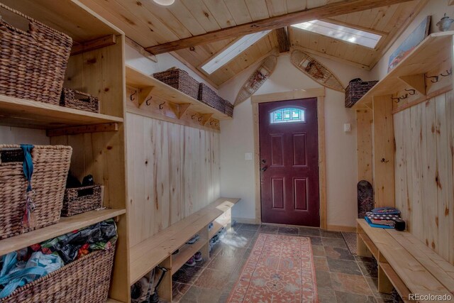 136 W Buckskin Rd, Alma, CO 80420 - mudroom featuring wood ceiling, stone tile flooring, baseboards, and vaulted ceiling with skylight