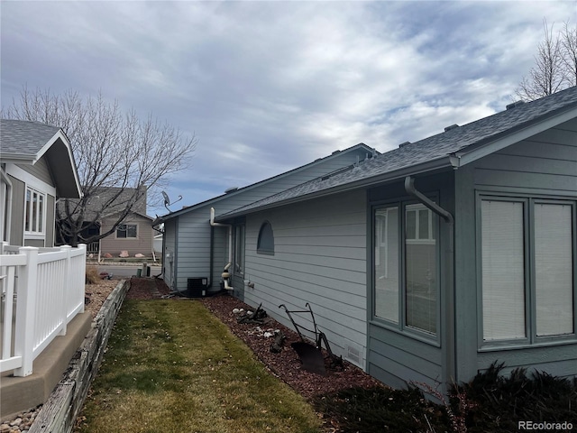 view of home's exterior with a lawn