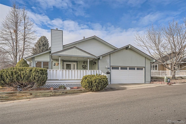 view of front facade with a porch and a garage