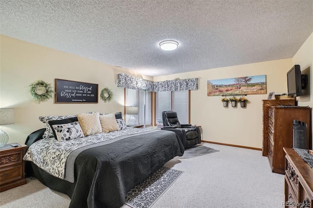 carpeted bedroom featuring a textured ceiling