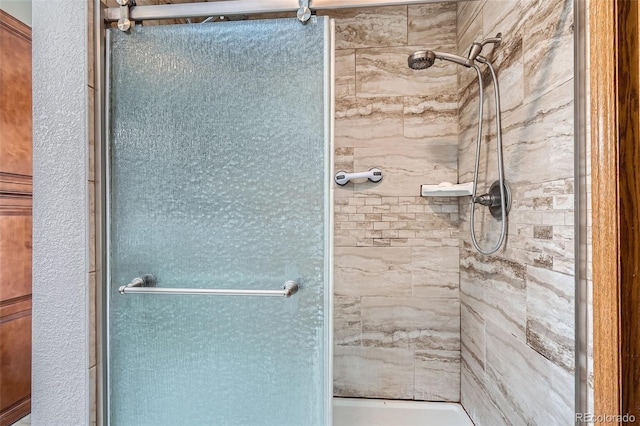 bathroom featuring an enclosed shower