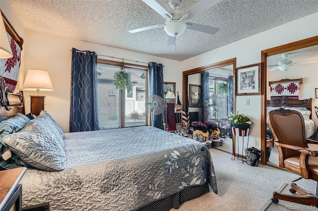 bedroom featuring ceiling fan, carpet, and a textured ceiling