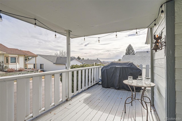 wooden terrace featuring a grill