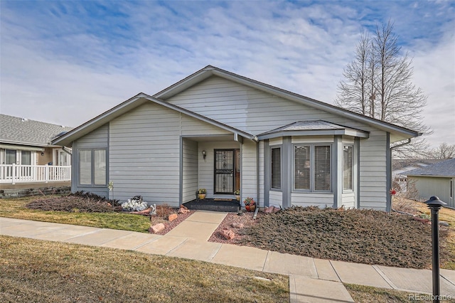 view of front of home with a front lawn