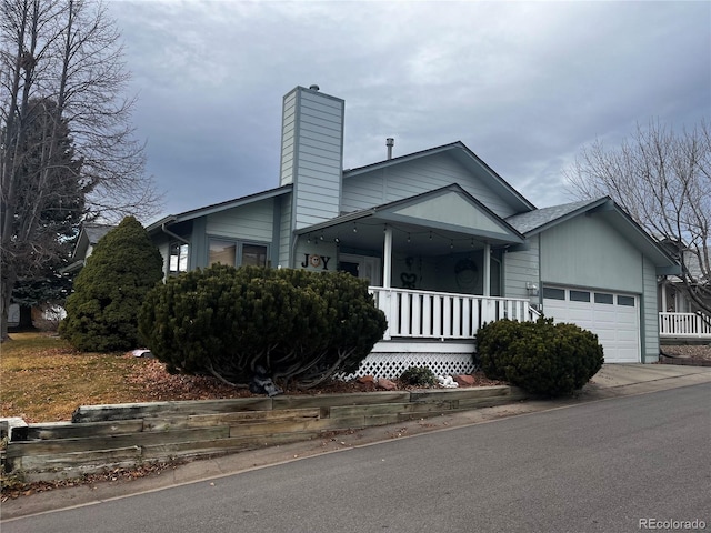 view of front of house with covered porch and a garage