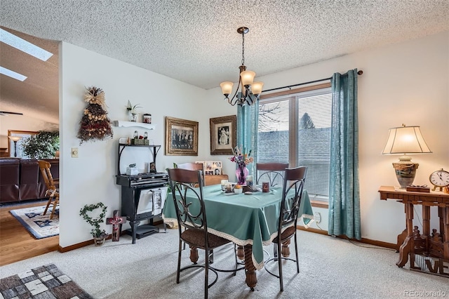 carpeted dining space featuring lofted ceiling, a textured ceiling, and a notable chandelier