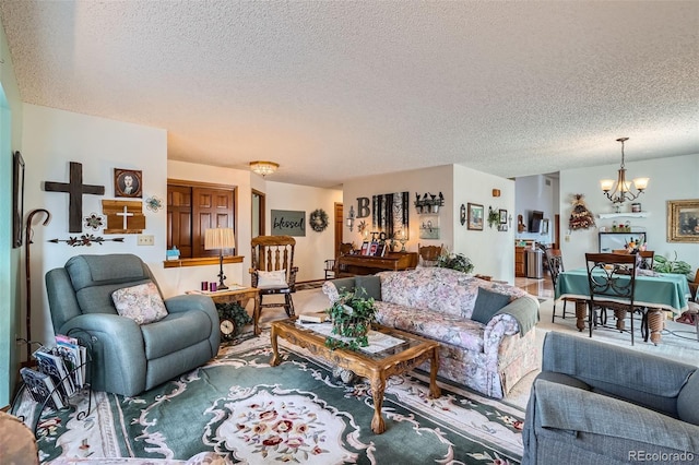 living room with a chandelier and a textured ceiling