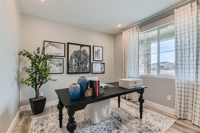 home office with recessed lighting, wood finished floors, and baseboards