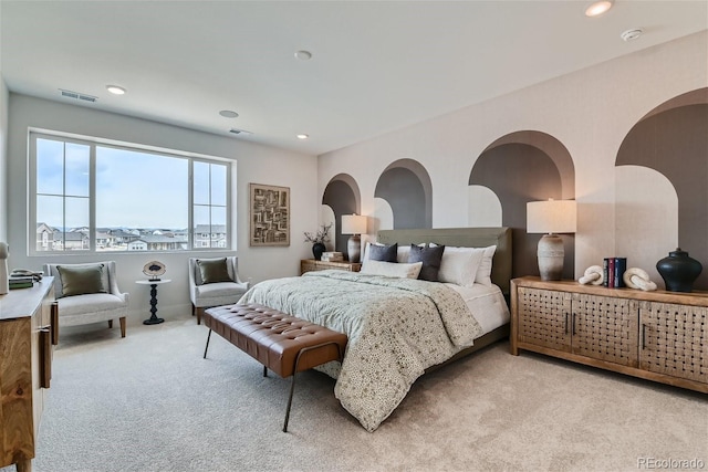 bedroom featuring light colored carpet, visible vents, and recessed lighting