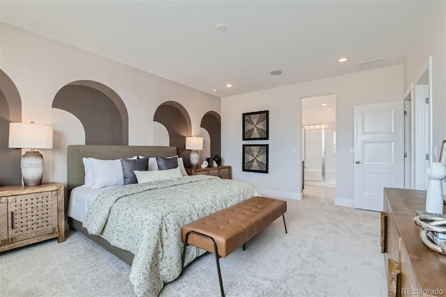 bedroom with light carpet, recessed lighting, ensuite bathroom, and baseboards