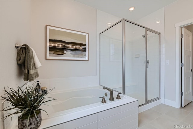 bathroom with a garden tub, tile patterned flooring, a shower stall, and recessed lighting