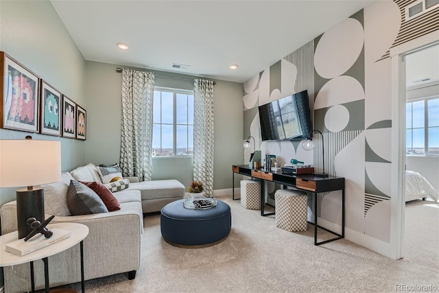 carpeted living room with baseboards, visible vents, and recessed lighting