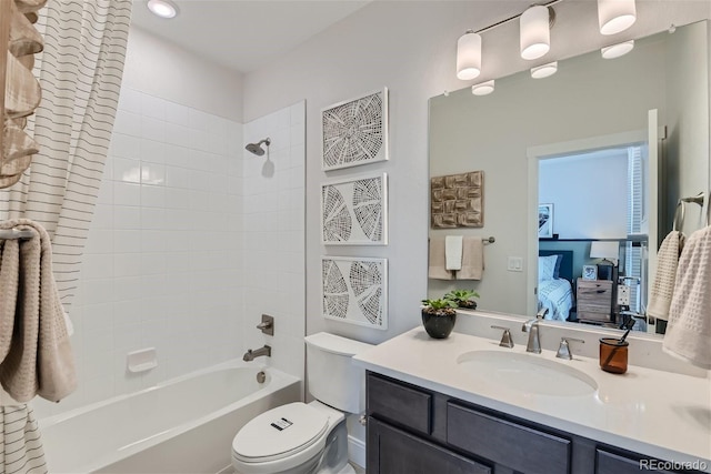 bathroom featuring  shower combination, vanity, toilet, and ensuite bathroom