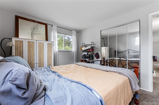 bedroom featuring carpet flooring and a closet