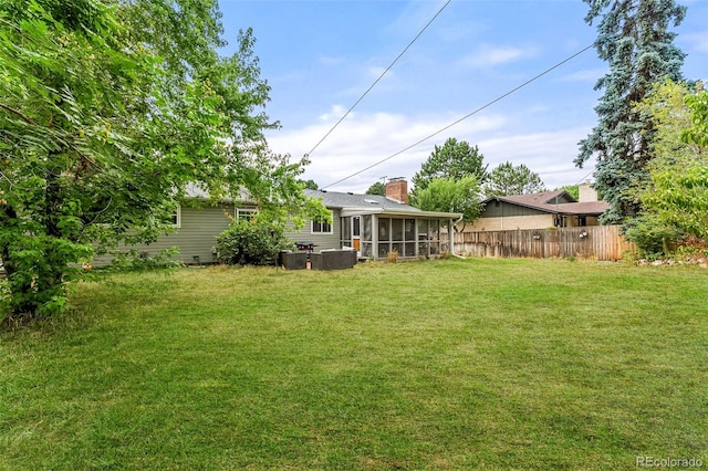 view of yard with a sunroom